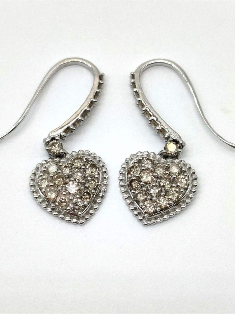 Diamond 1 CT white gold dangling earrings in 18K .